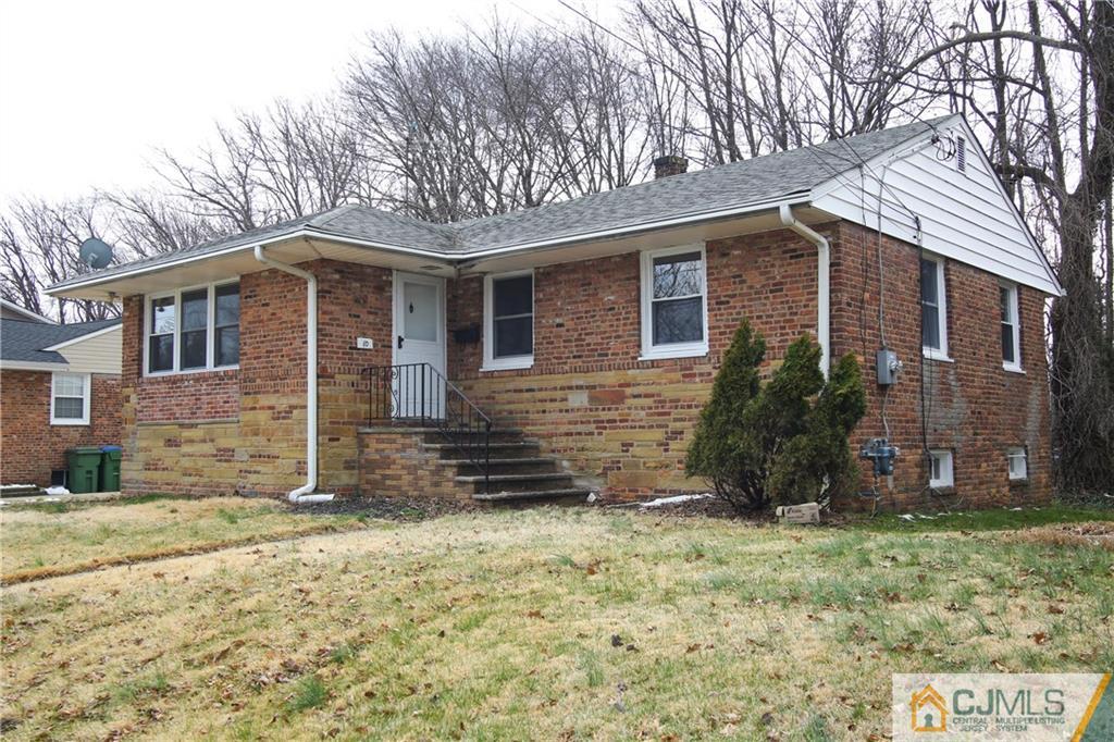 10 Gurley Road Edison, NJ 08817 - Photo 1 of 17 a front view of a house with garden