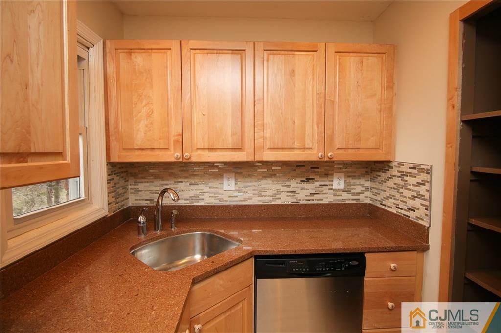 10 Gurley Road Edison, NJ 08817 - Photo 7 of 17 a kitchen with a sink and cabinets