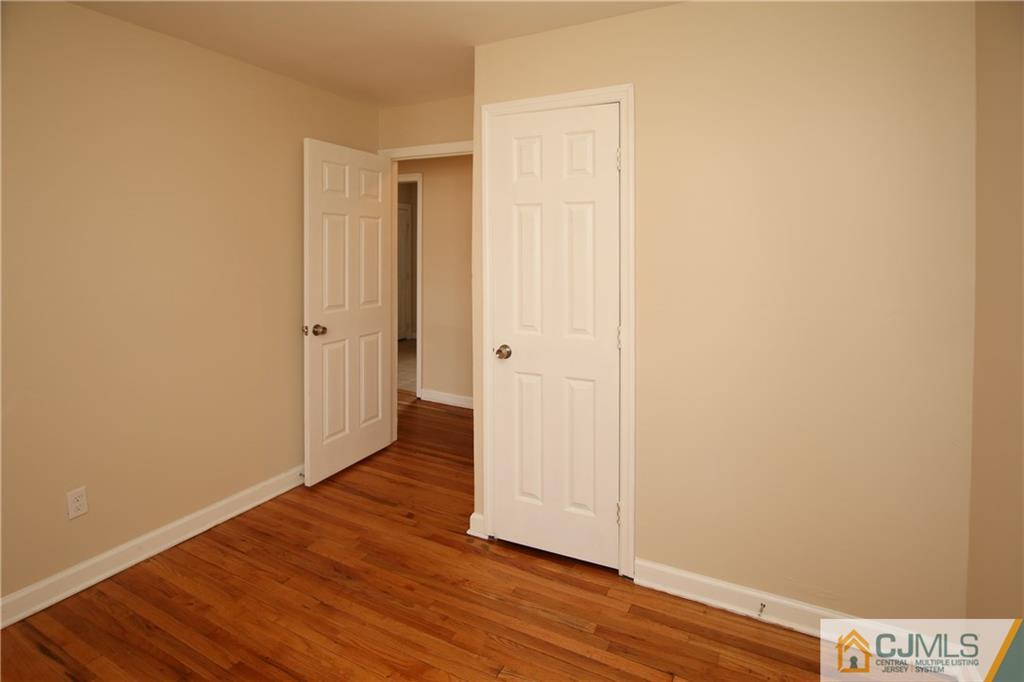 10 Gurley Road Edison, NJ 08817 - Photo 9 of 17 a view of an empty room with wooden floor