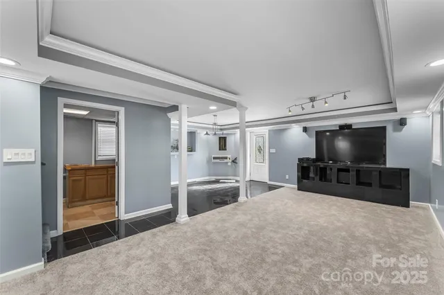 a bedroom with furniture and a flat screen tv