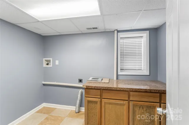 a bathroom with a sink and a window