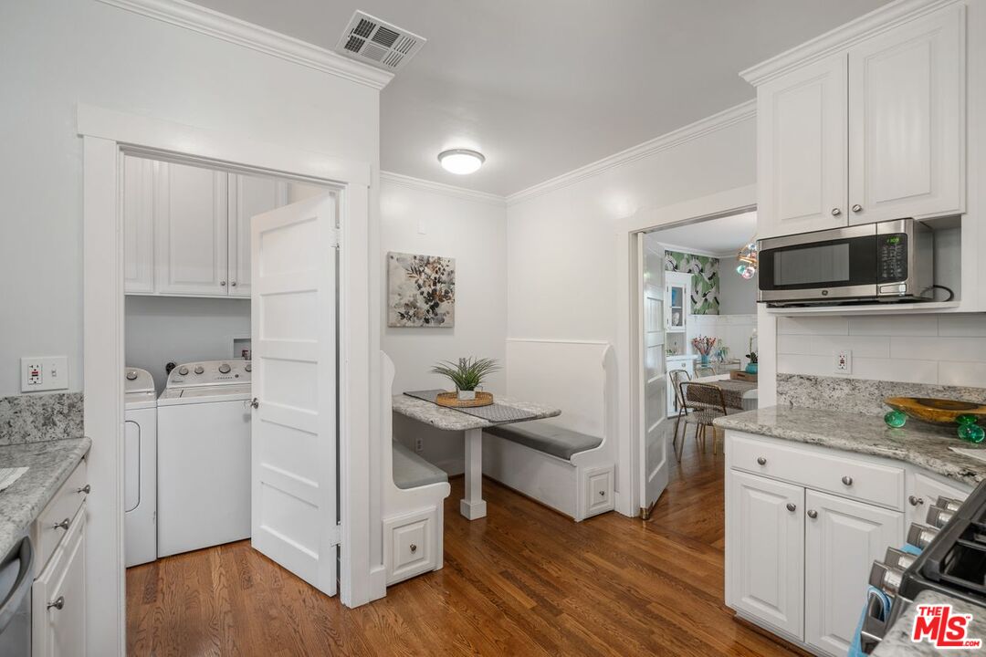 1266 Wesley Avenue Pasadena, CA 91104 - Photo 12 of 25 a kitchen with cabinets and wooden floor