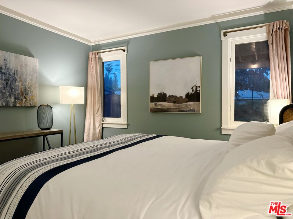 1266 Wesley Avenue Pasadena, CA 91104 - Photo 14 of 25 a bedroom with a bed and window