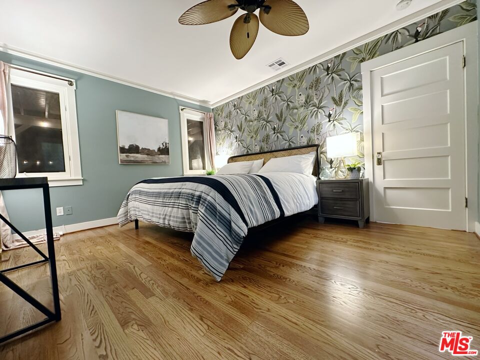 1266 Wesley Avenue Pasadena, CA 91104 - Photo 15 of 25 a bedroom with a bed and painting on the wall