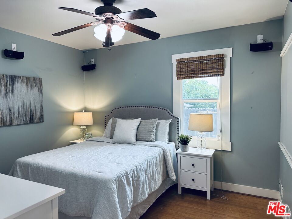 1266 Wesley Avenue Pasadena, CA 91104 - Photo 18 of 25 a bedroom with a bed and a window