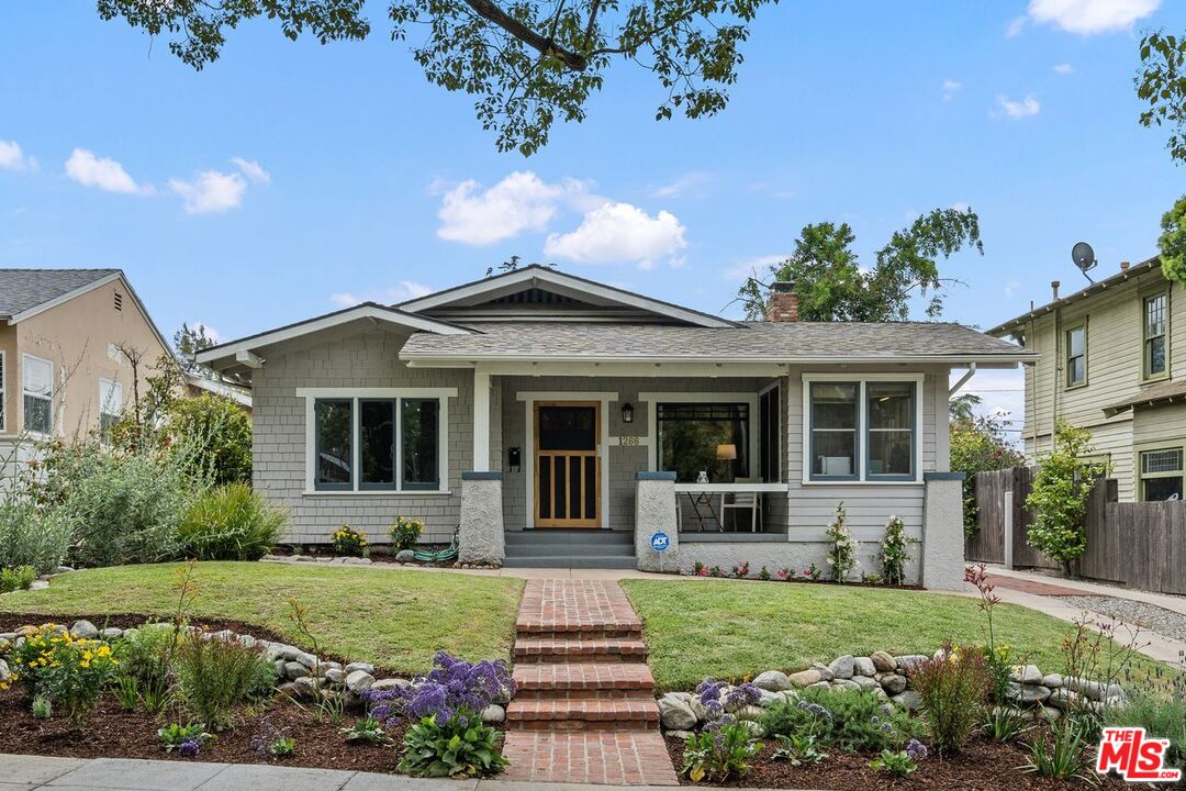 1266 Wesley Avenue Pasadena, CA 91104 - Photo 2 of 25 a front view of a house with garden
