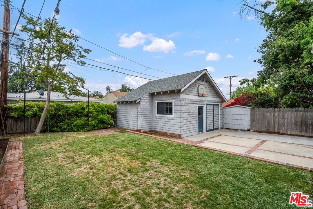 1266 Wesley Avenue Pasadena, CA 91104 - Photo 22 of 25 a view of a house with a yard and potted plants