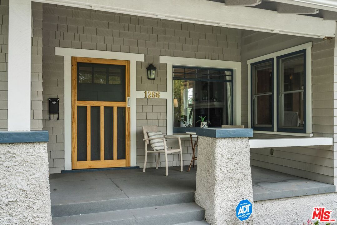 1266 Wesley Avenue Pasadena, CA 91104 - Photo 3 of 25 front view of a house with glass windows