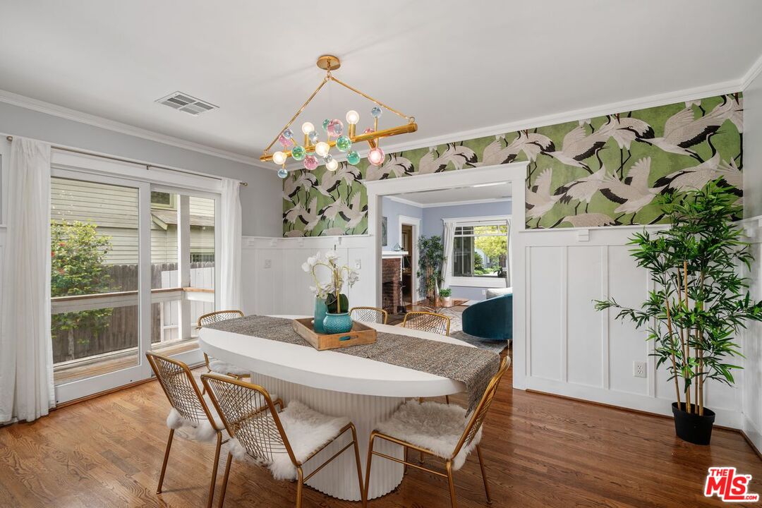 1266 Wesley Avenue Pasadena, CA 91104 - Photo 8 of 25 a view of a dining room with furniture and wooden floor