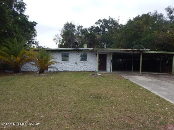 a view of house with outdoor space and garden