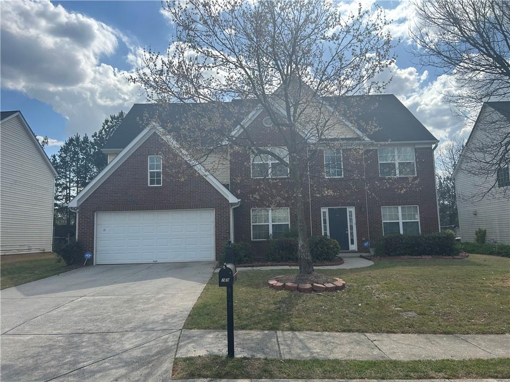 769 Roxholly Lane Northeast Buford, GA 30518 - Photo 1 of 81 a front view of a house with a yard