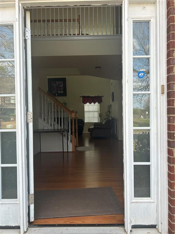 769 Roxholly Lane Northeast Buford, GA 30518 - Photo 14 of 81 a view of entryway and hall with wooden floor