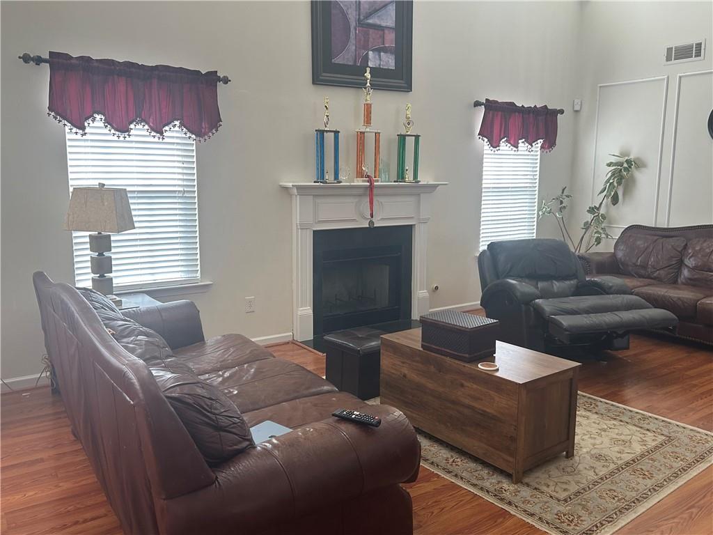 769 Roxholly Lane Northeast Buford, GA 30518 - Photo 25 of 81 a living room with furniture and a fireplace