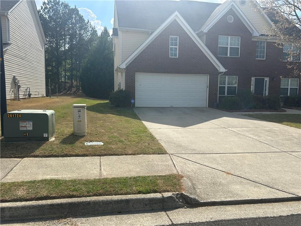 769 Roxholly Lane Northeast Buford, GA 30518 - Photo 4 of 81 a view of a brick house with a outdoor space