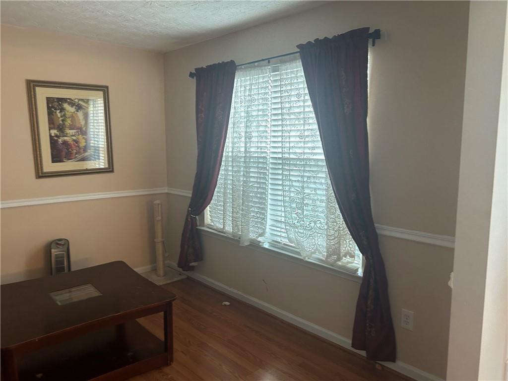 769 Roxholly Lane Northeast Buford, GA 30518 - Photo 44 of 81 a view of a workspace with furniture and a window