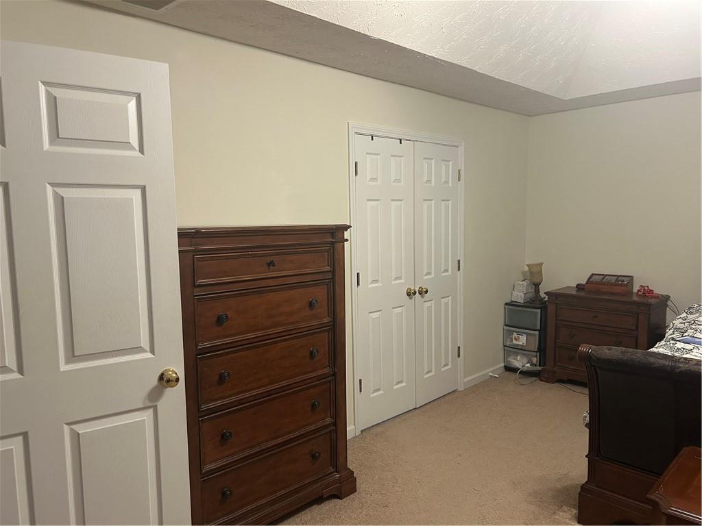 769 Roxholly Lane Northeast Buford, GA 30518 - Photo 48 of 81 a view of a closet area with dresser