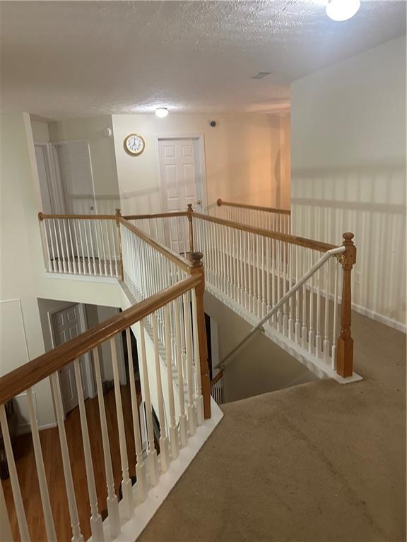 769 Roxholly Lane Northeast Buford, GA 30518 - Photo 58 of 81 a view of staircase with wooden floor and stairs