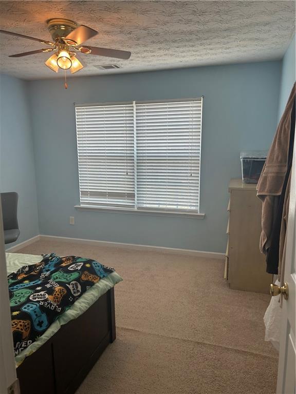 769 Roxholly Lane Northeast Buford, GA 30518 - Photo 66 of 81 a bedroom with a bed and a window