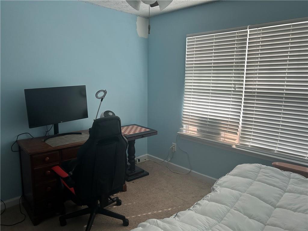 769 Roxholly Lane Northeast Buford, GA 30518 - Photo 76 of 81 a view of a workspace with furniture and a window
