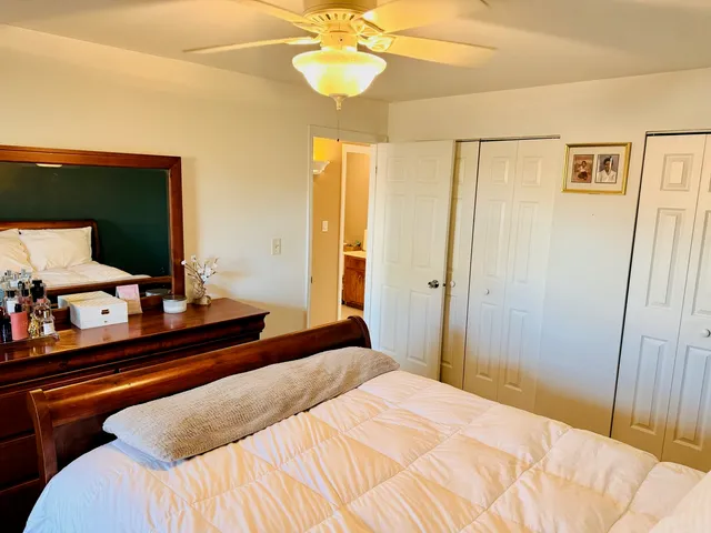 a bedroom with a bed and a dresser