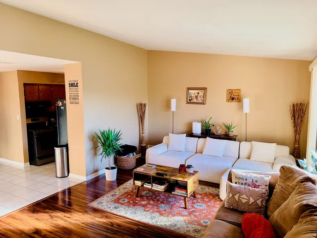 a kitchen with a refrigerator and a stove