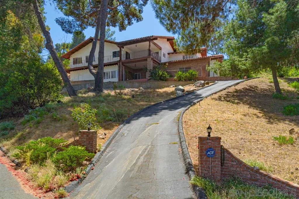 1307 Van Vechten Road El Cajon, CA 92019 - Photo 1 of 24 a front view of a house with a yard