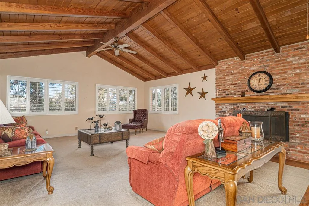 1307 Van Vechten Road El Cajon, CA 92019 - Photo 12 of 24 a living room with furniture and a clock