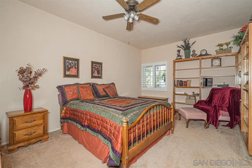 1307 Van Vechten Road El Cajon, CA 92019 - Photo 17 of 24 a bedroom with a bed and a chandelier