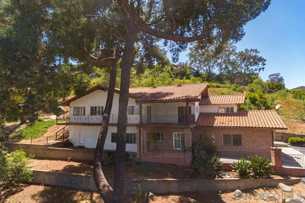 1307 Van Vechten Road El Cajon, CA 92019 - Photo 2 of 24 a front view of a house with a yard