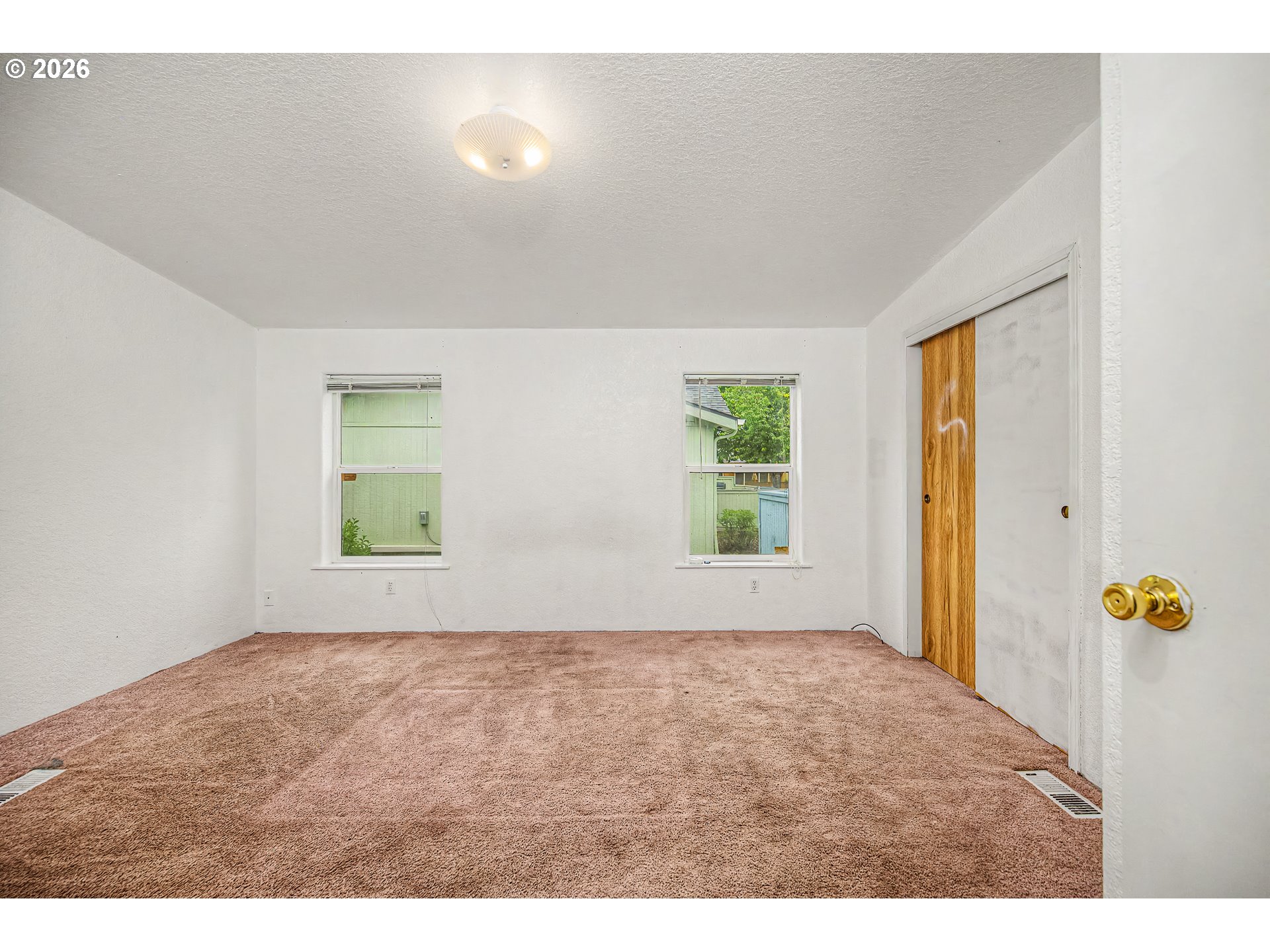 5510 E Street Springfield, OR 97478 - Photo 12 of 16 a view of an empty room with a window