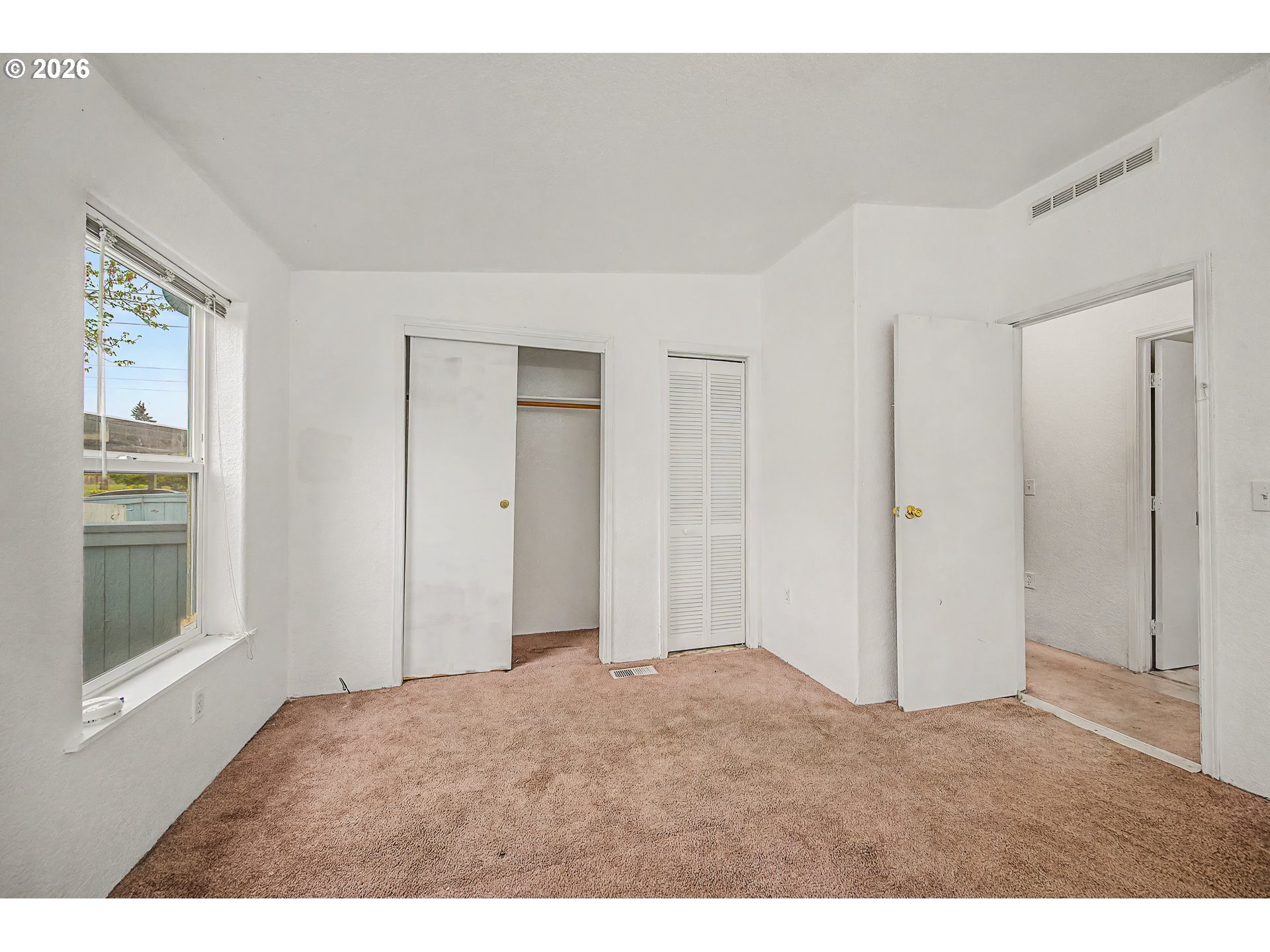 5510 E Street Springfield, OR 97478 - Photo 13 of 16 a big room with closet and windows
