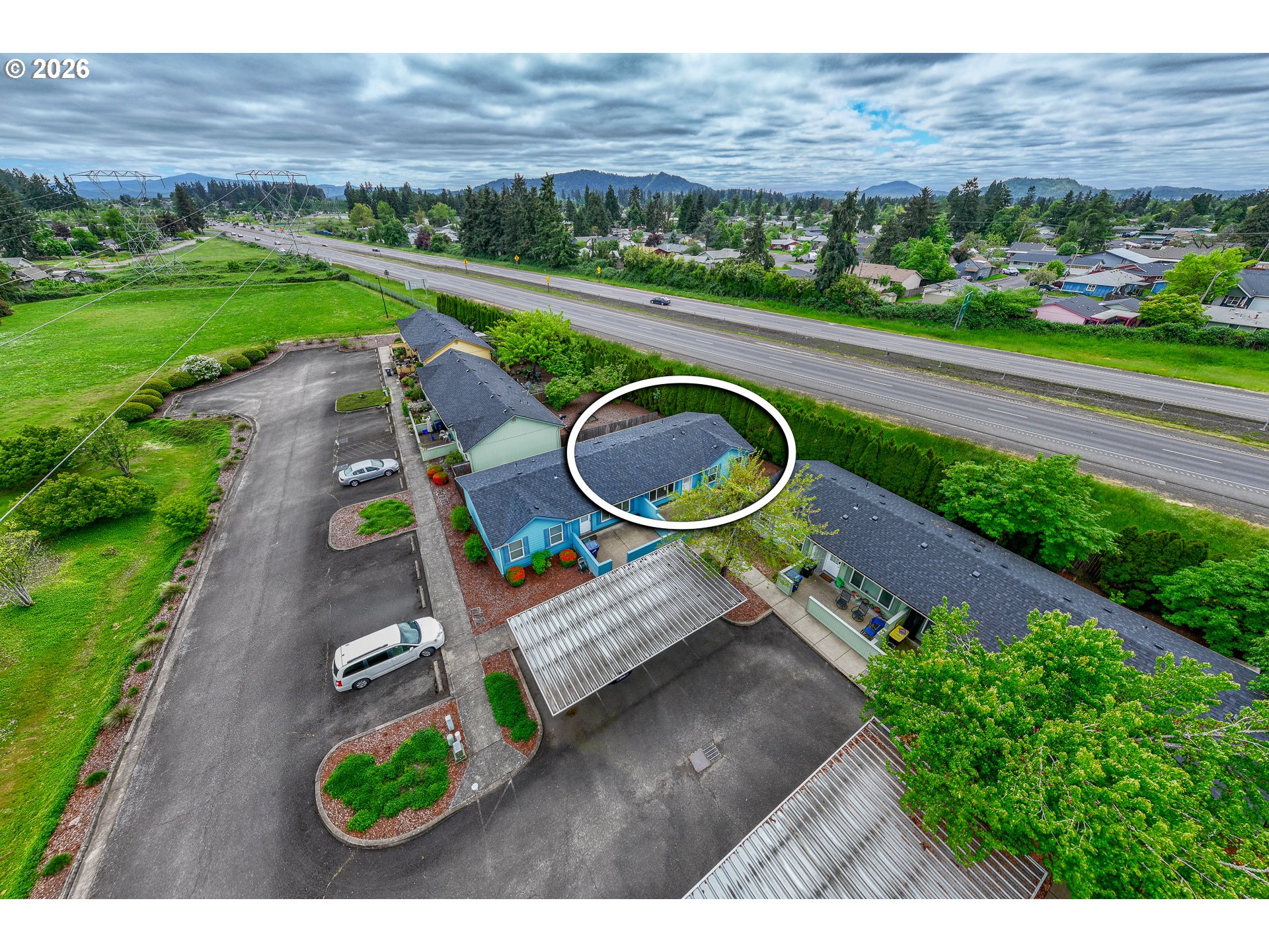 5510 E Street Springfield, OR 97478 - Photo 16 of 16 an aerial view of a house with a yard and green space