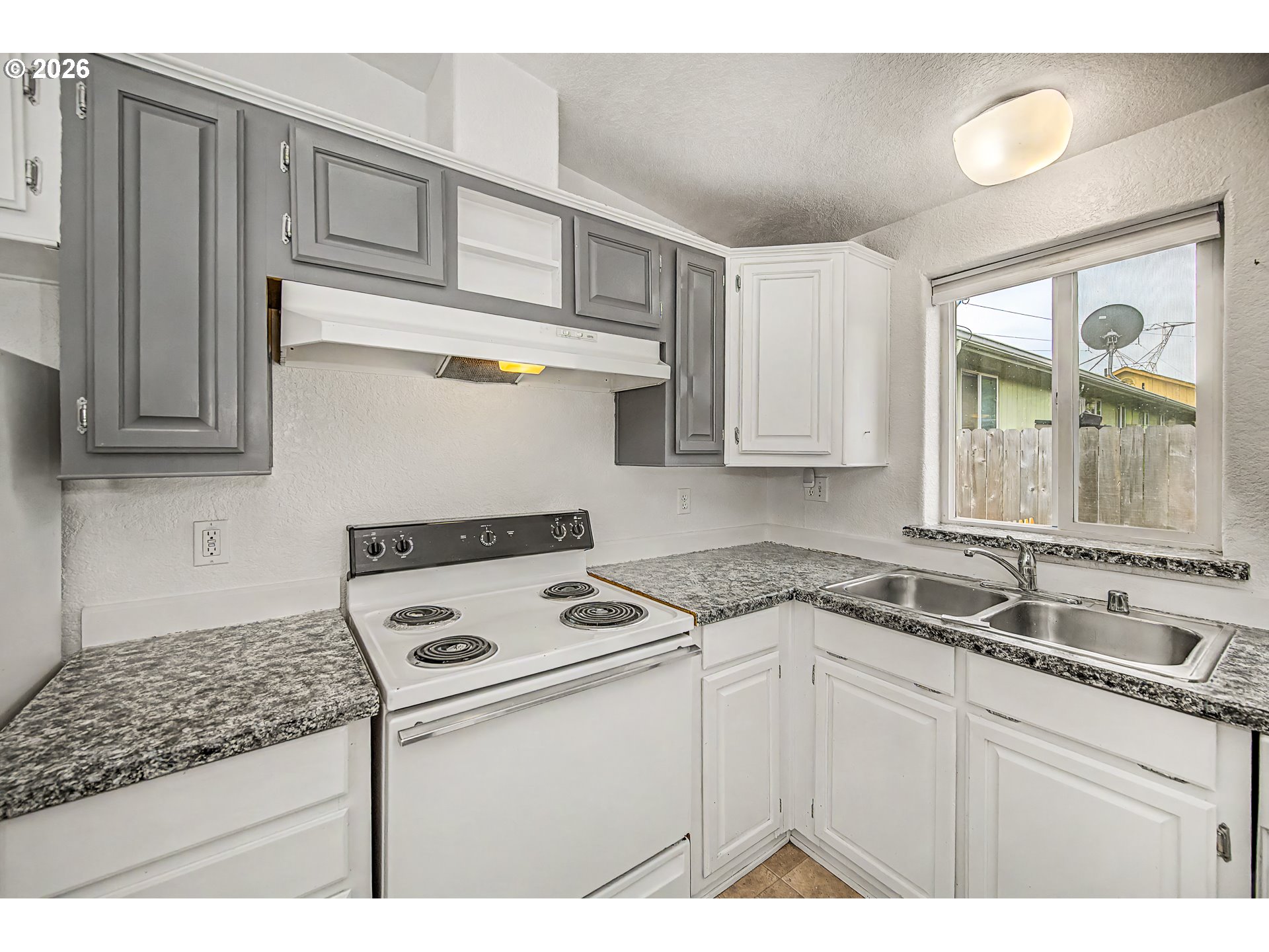 5510 E Street Springfield, OR 97478 - Photo 7 of 16 a kitchen with appliances cabinets and a sink