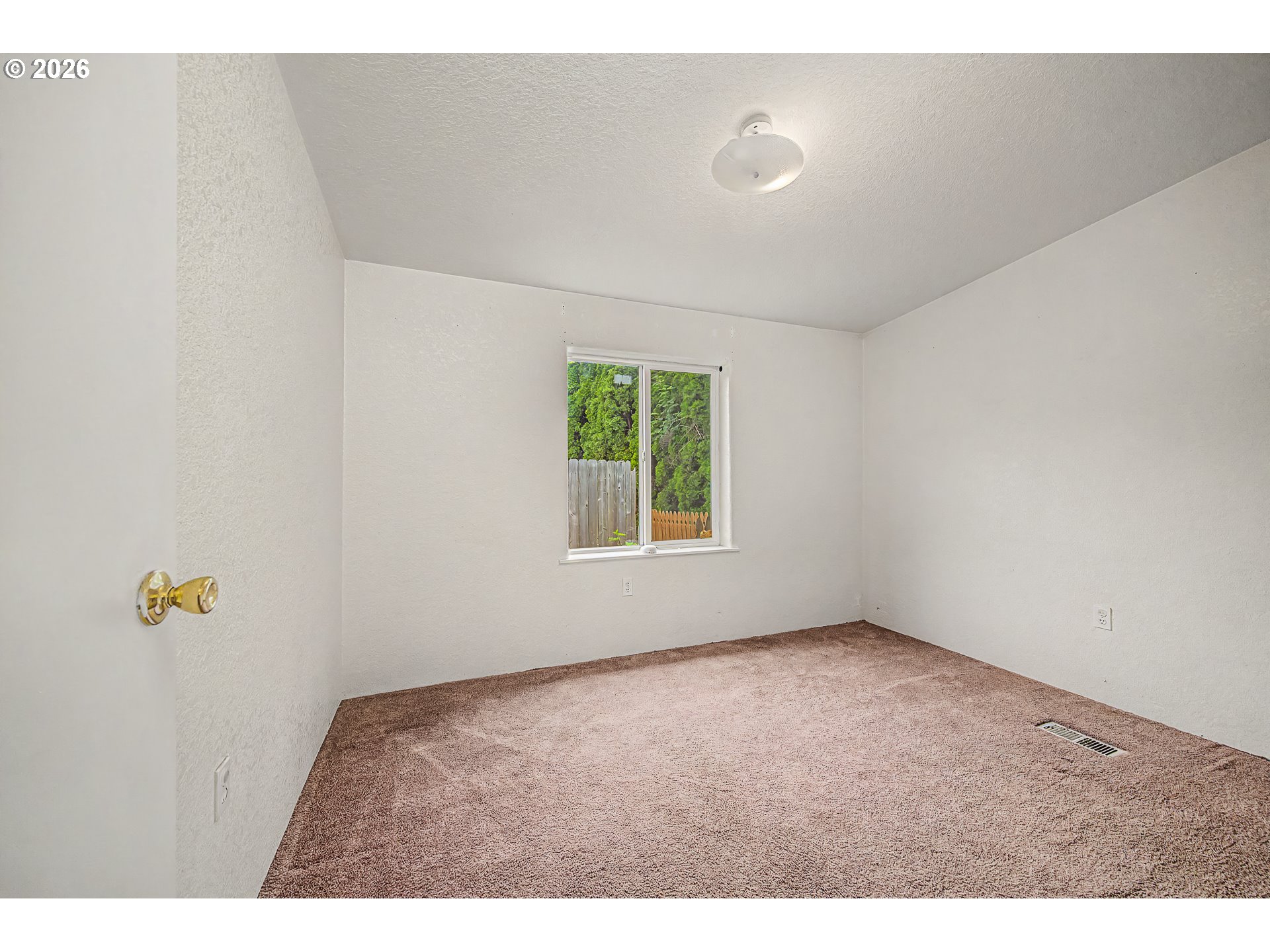 5510 E Street Springfield, OR 97478 - Photo 10 of 16 a view of an empty room with a window