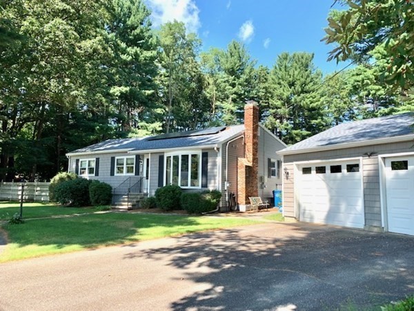 4 Baldwin Road Billerica, MA 01821 - Photo 3 of 41 a front view of a house with a garden and trees