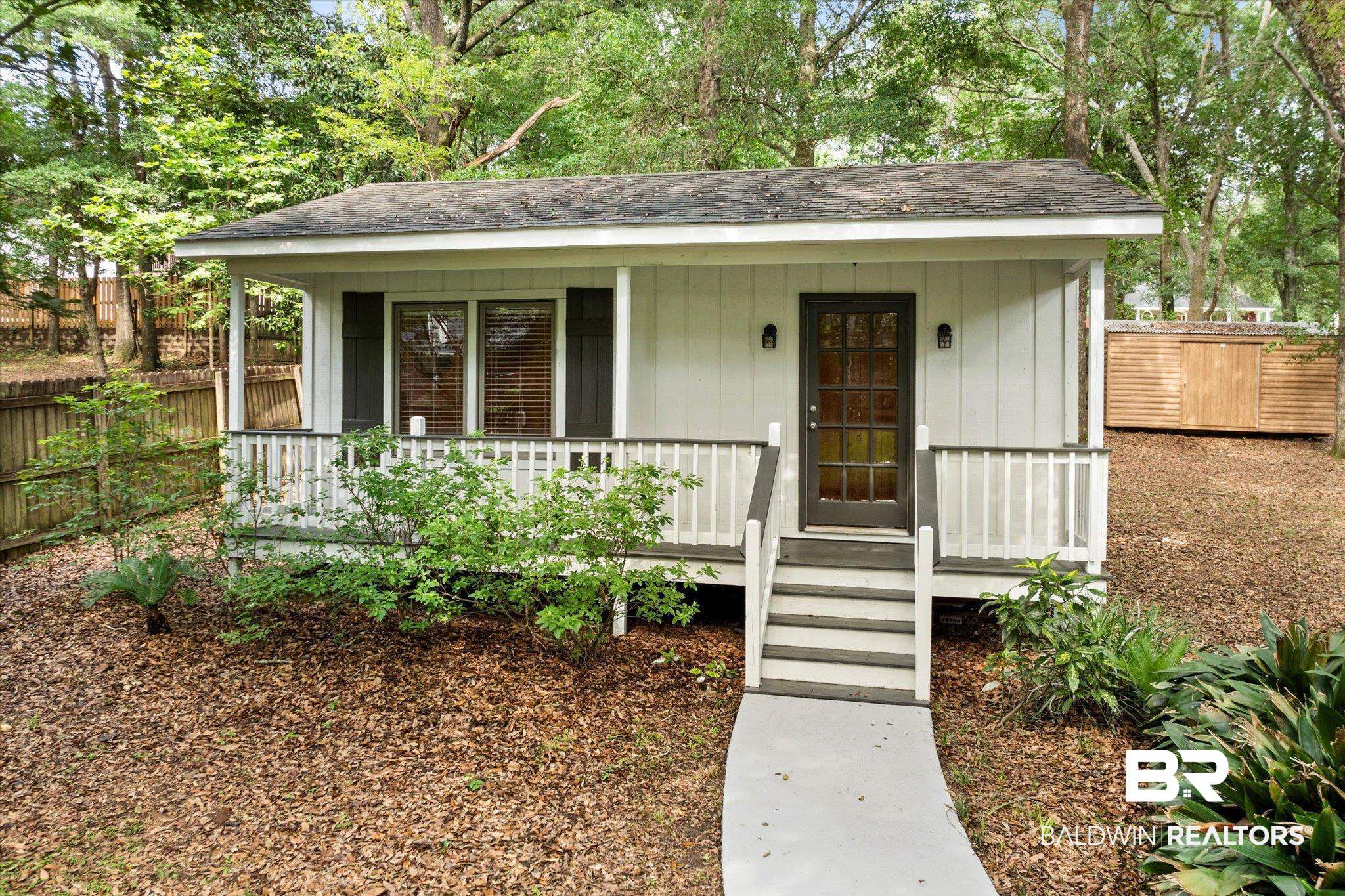 3715 Latigo Road Mobile, AL 36695 - Photo 21 of 39 View of front of property with covered porch and a shingled roof