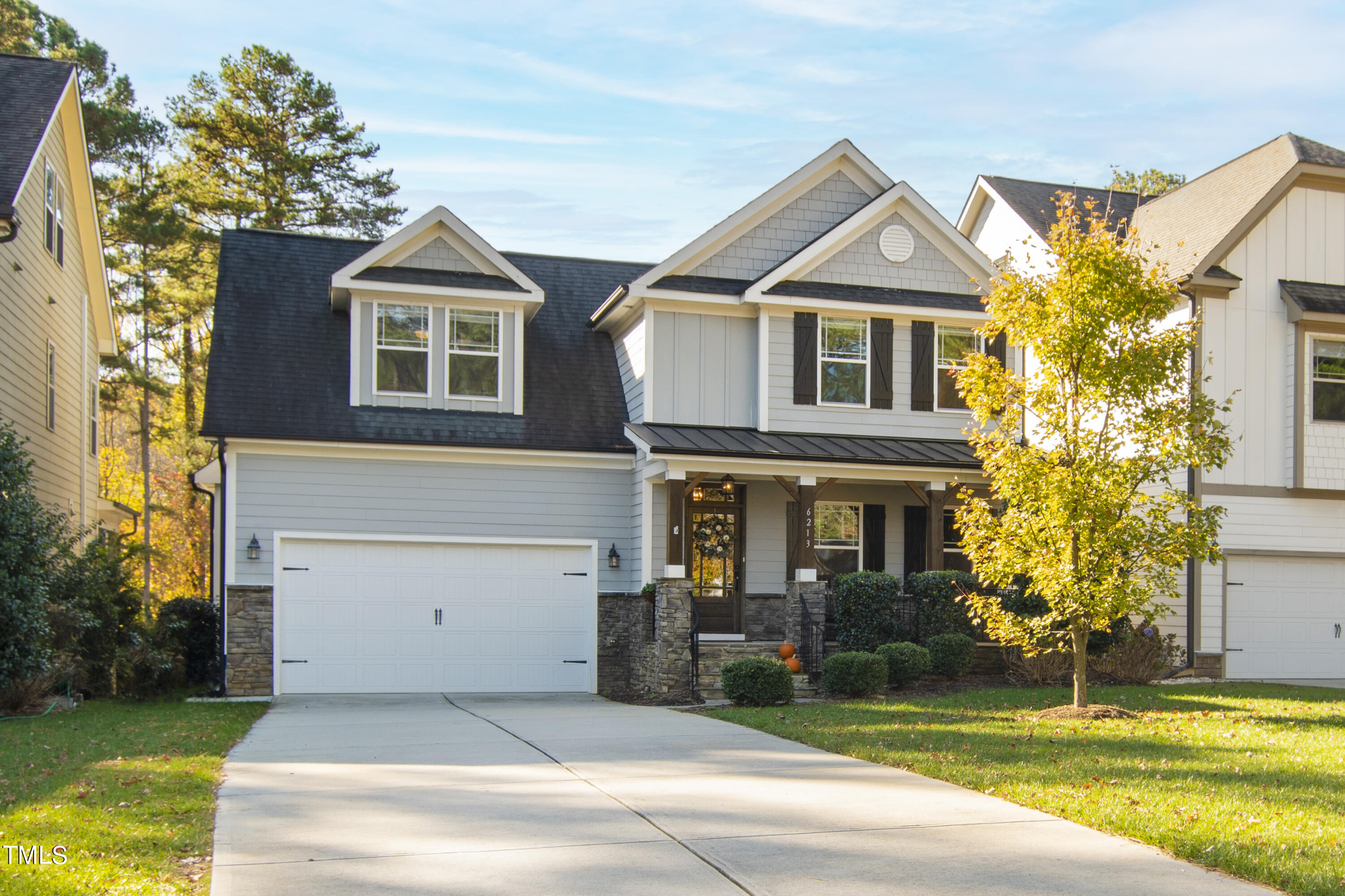 6213 Blanche Drive Raleigh, NC 27607 - Photo 1 of 48 a front view of a house with a yard and garage