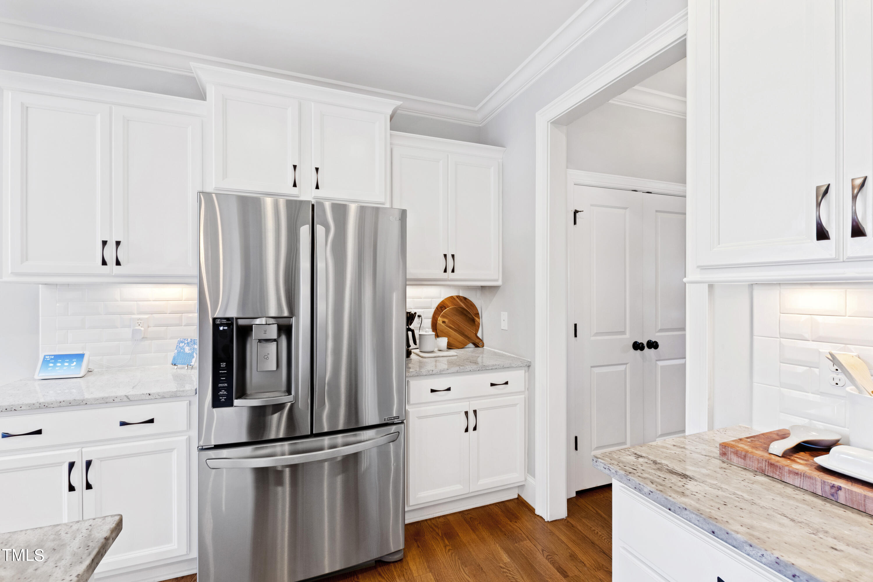 6213 Blanche Drive Raleigh, NC 27607 - Photo 13 of 48 a kitchen with granite countertop a refrigerator and a stove top oven