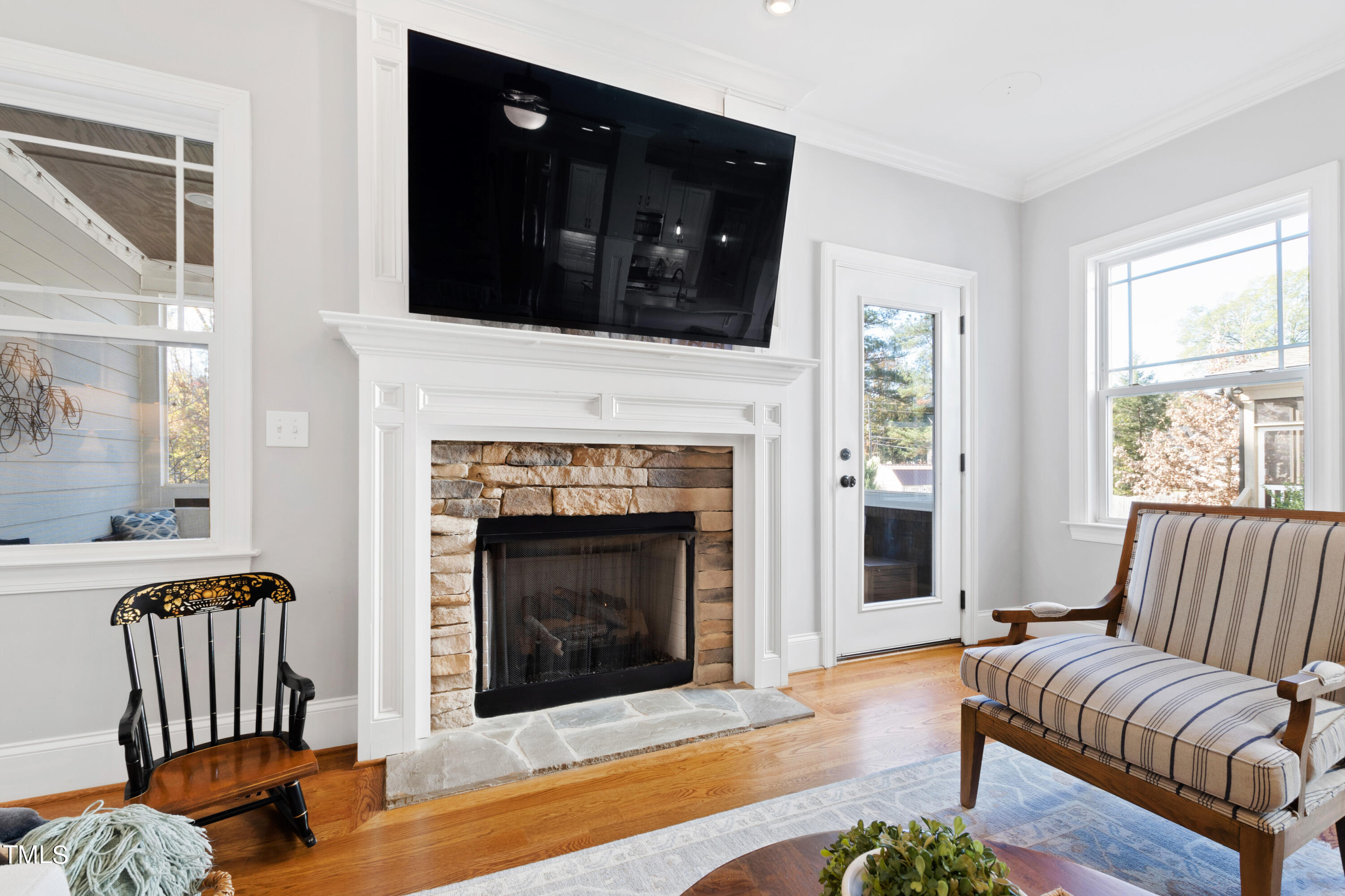 6213 Blanche Drive Raleigh, NC 27607 - Photo 18 of 48 a living room with furniture and a fireplace