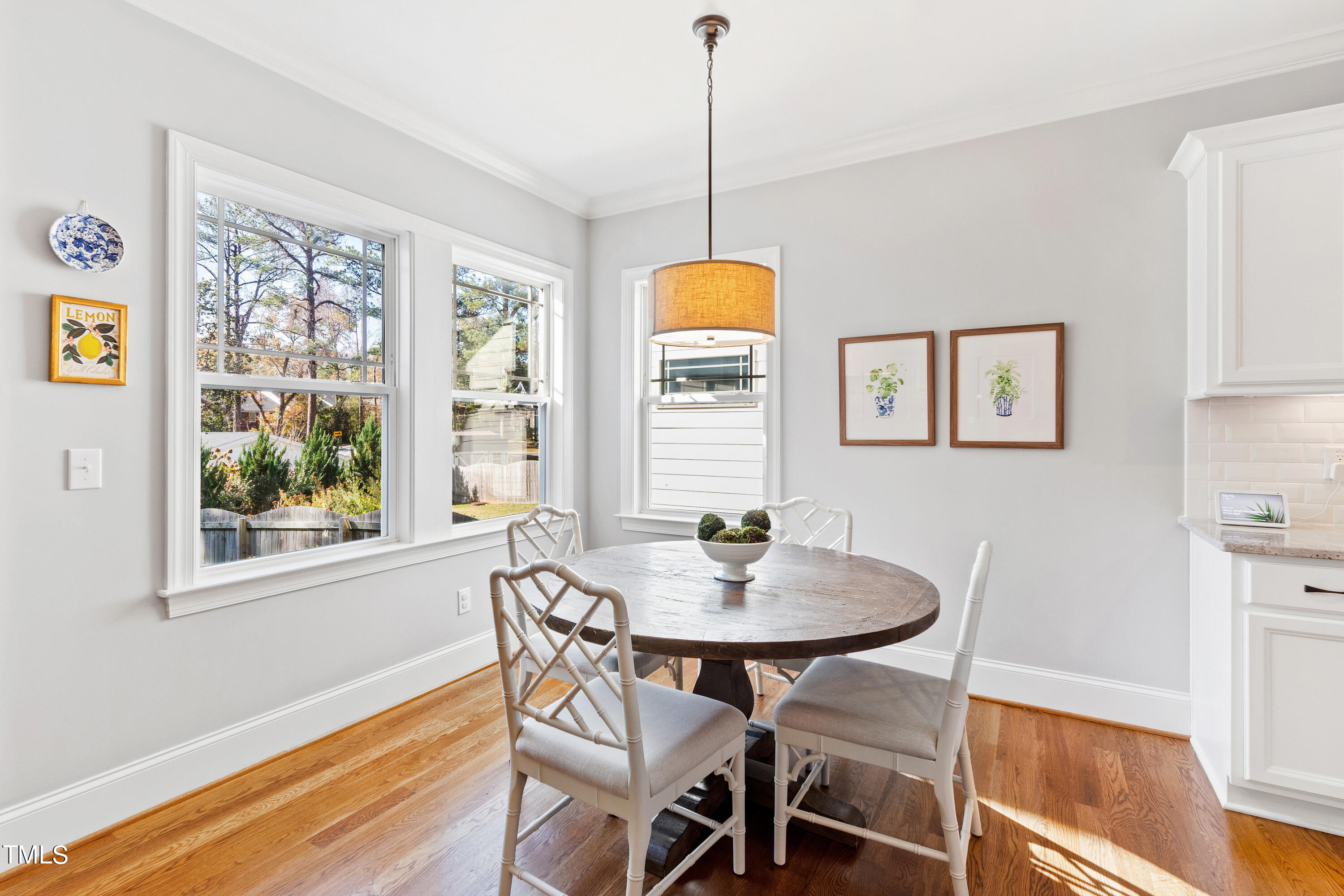 6213 Blanche Drive Raleigh, NC 27607 - Photo 20 of 48 a dining room with furniture a rug and wooden floor