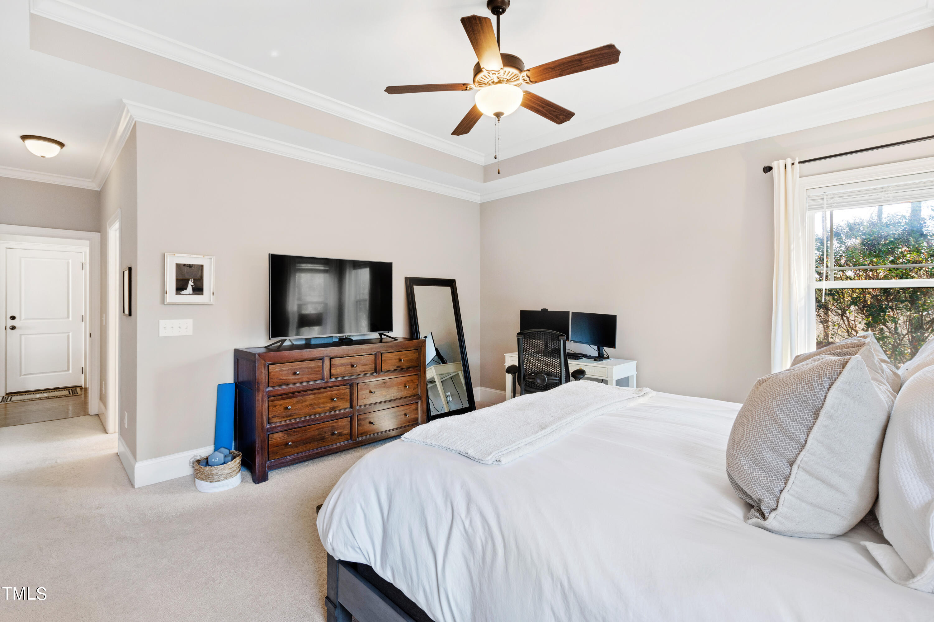 6213 Blanche Drive Raleigh, NC 27607 - Photo 22 of 48 a bedroom with a bed and a chandelier