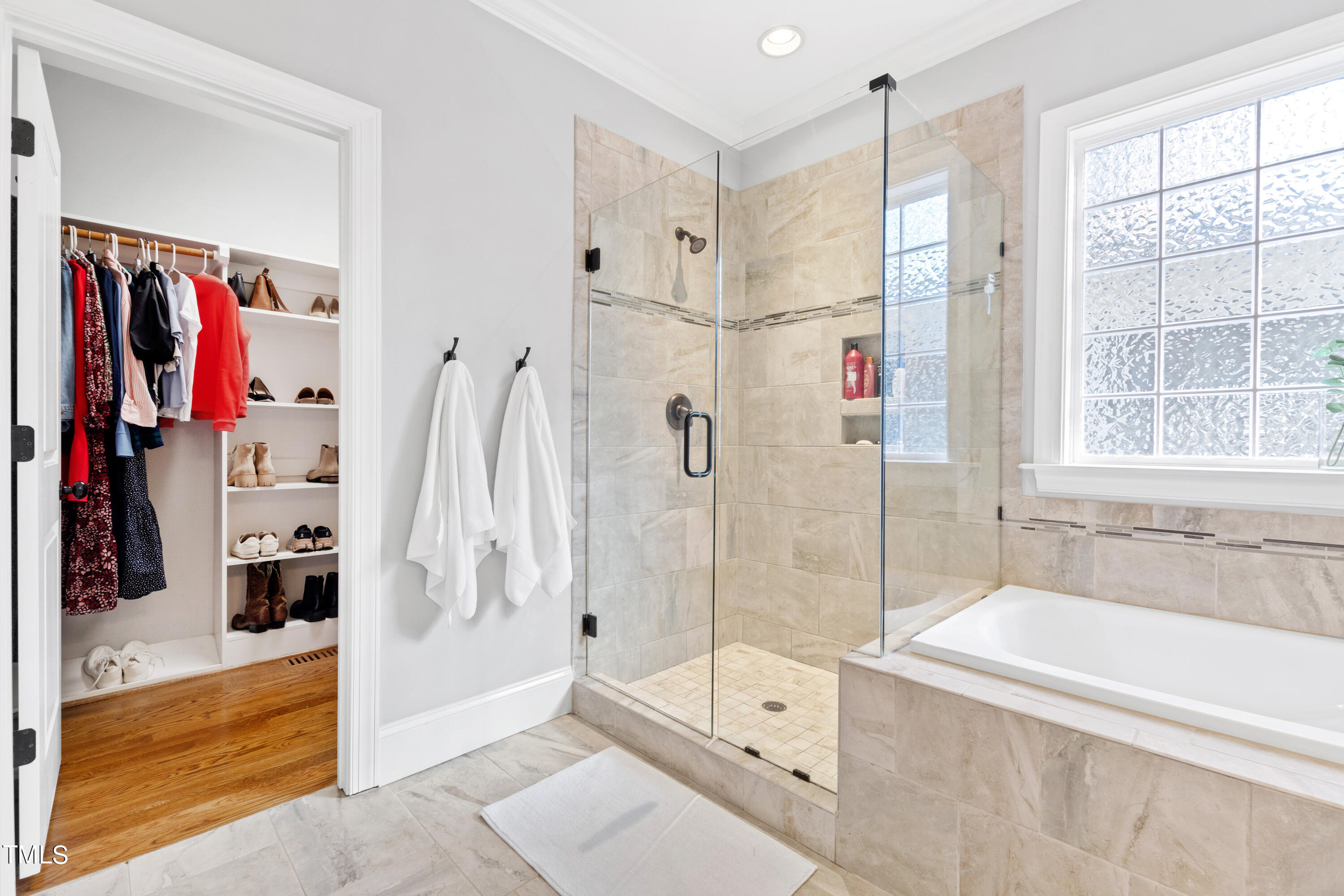 6213 Blanche Drive Raleigh, NC 27607 - Photo 24 of 48 a bathroom with a bathtub and a shower