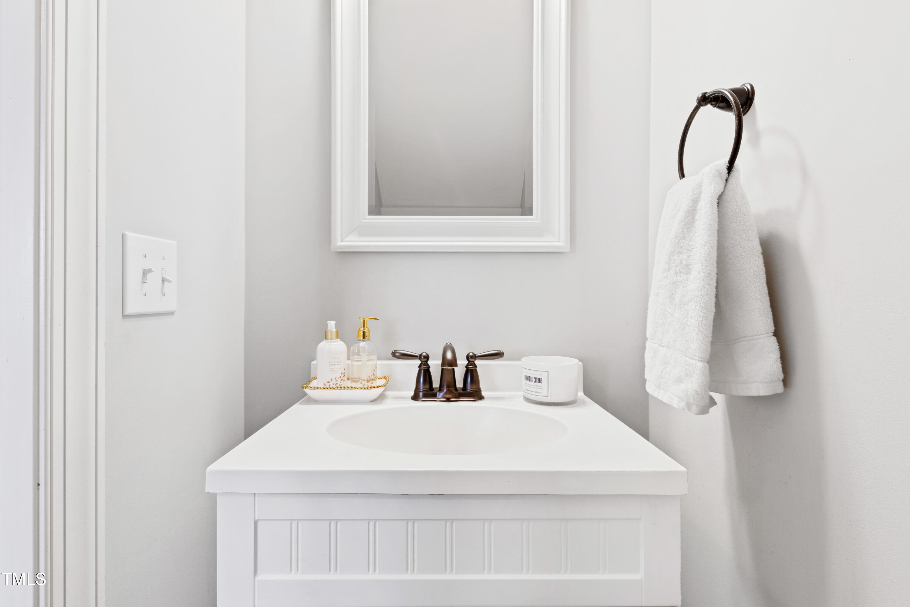 6213 Blanche Drive Raleigh, NC 27607 - Photo 28 of 48 a bathroom with a sink and a mirror