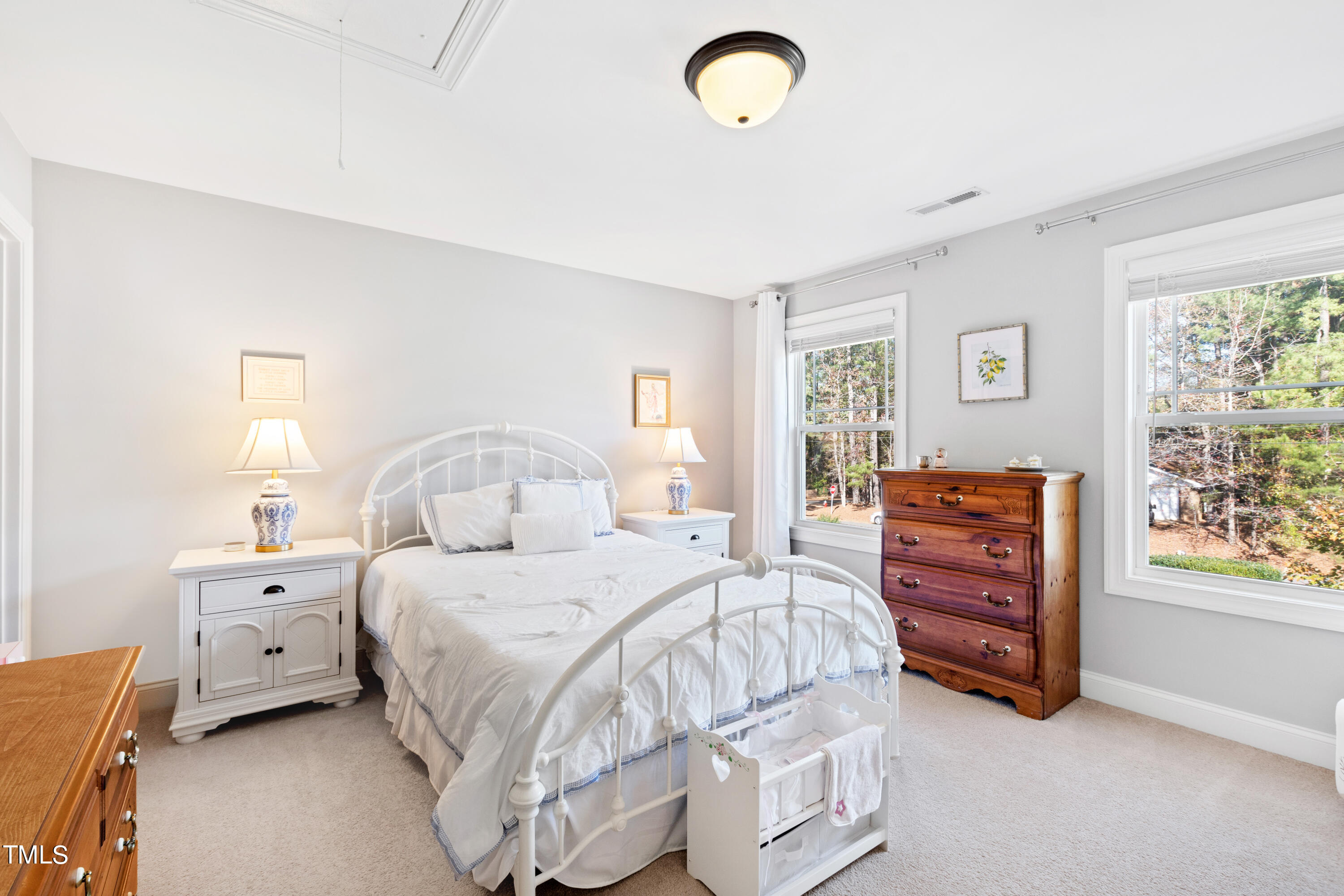 6213 Blanche Drive Raleigh, NC 27607 - Photo 31 of 48 a bedroom with a bed and a window