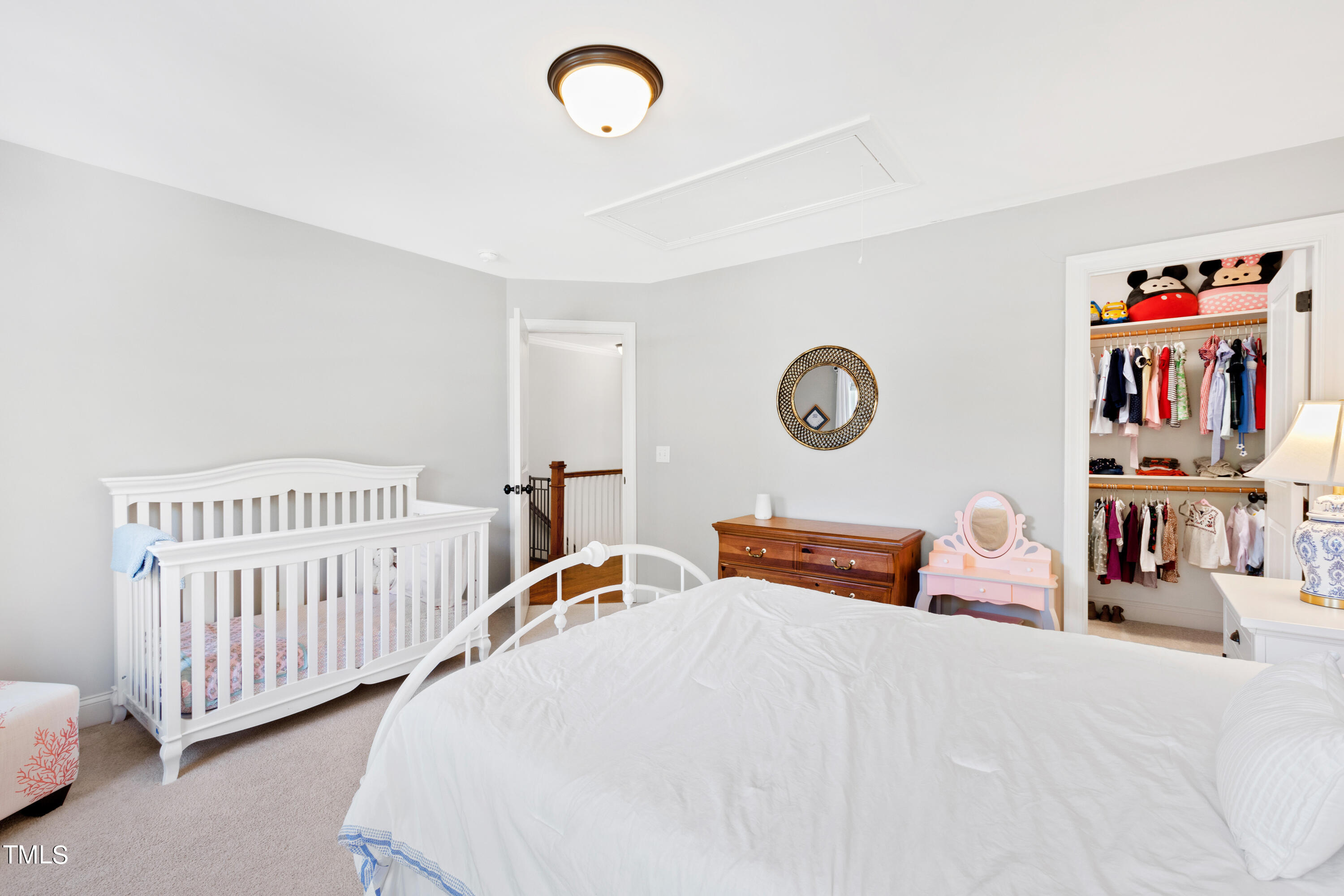 6213 Blanche Drive Raleigh, NC 27607 - Photo 32 of 48 a bedroom with a bed and a large window