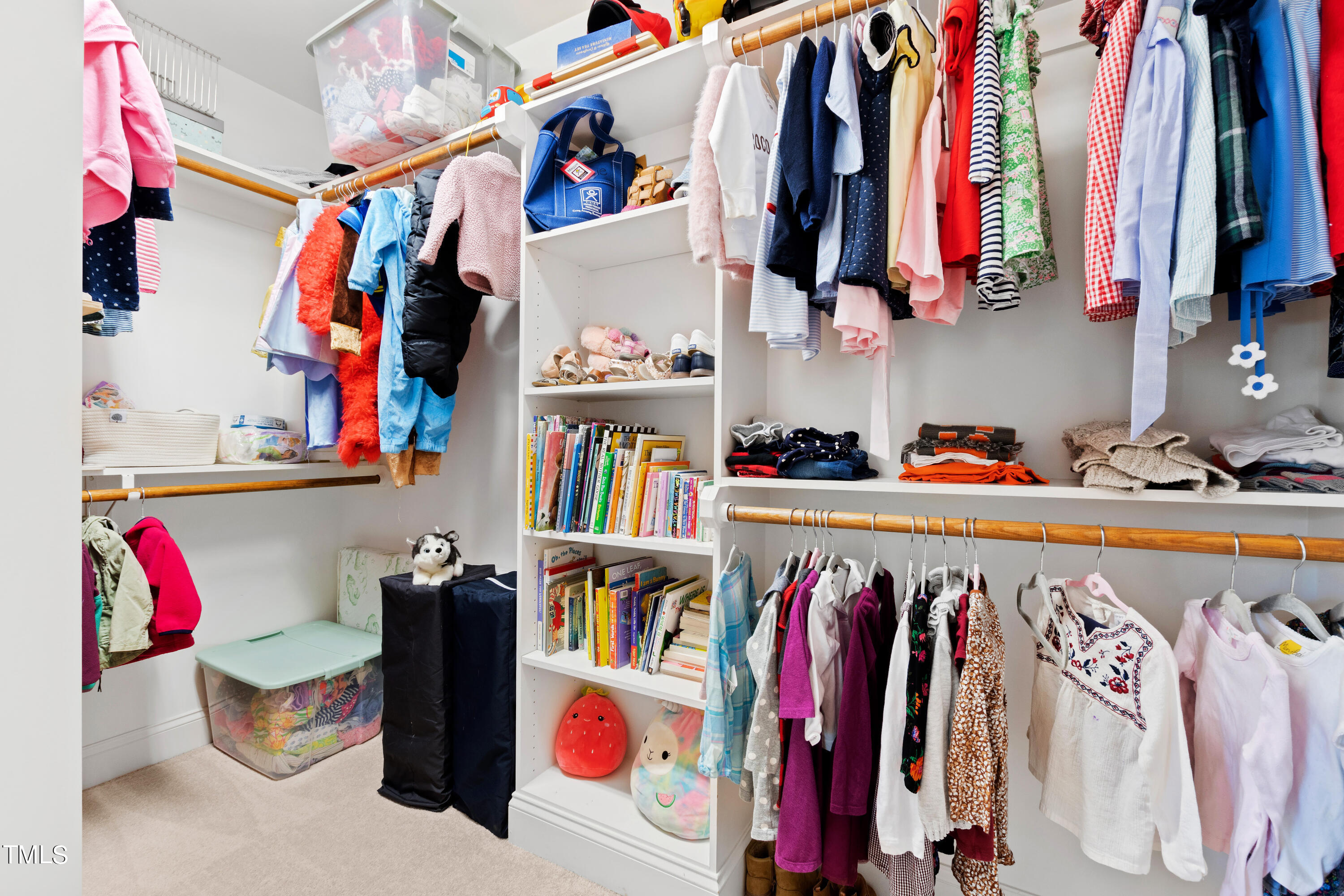 6213 Blanche Drive Raleigh, NC 27607 - Photo 33 of 48 a view of walk in closet with clothes and shoes