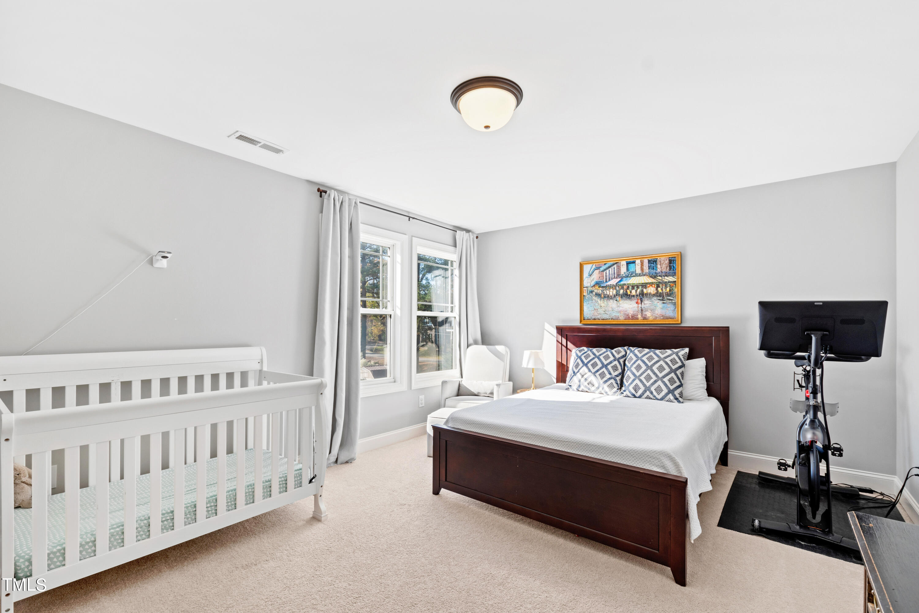 6213 Blanche Drive Raleigh, NC 27607 - Photo 34 of 48 a bedroom with a bed and a window