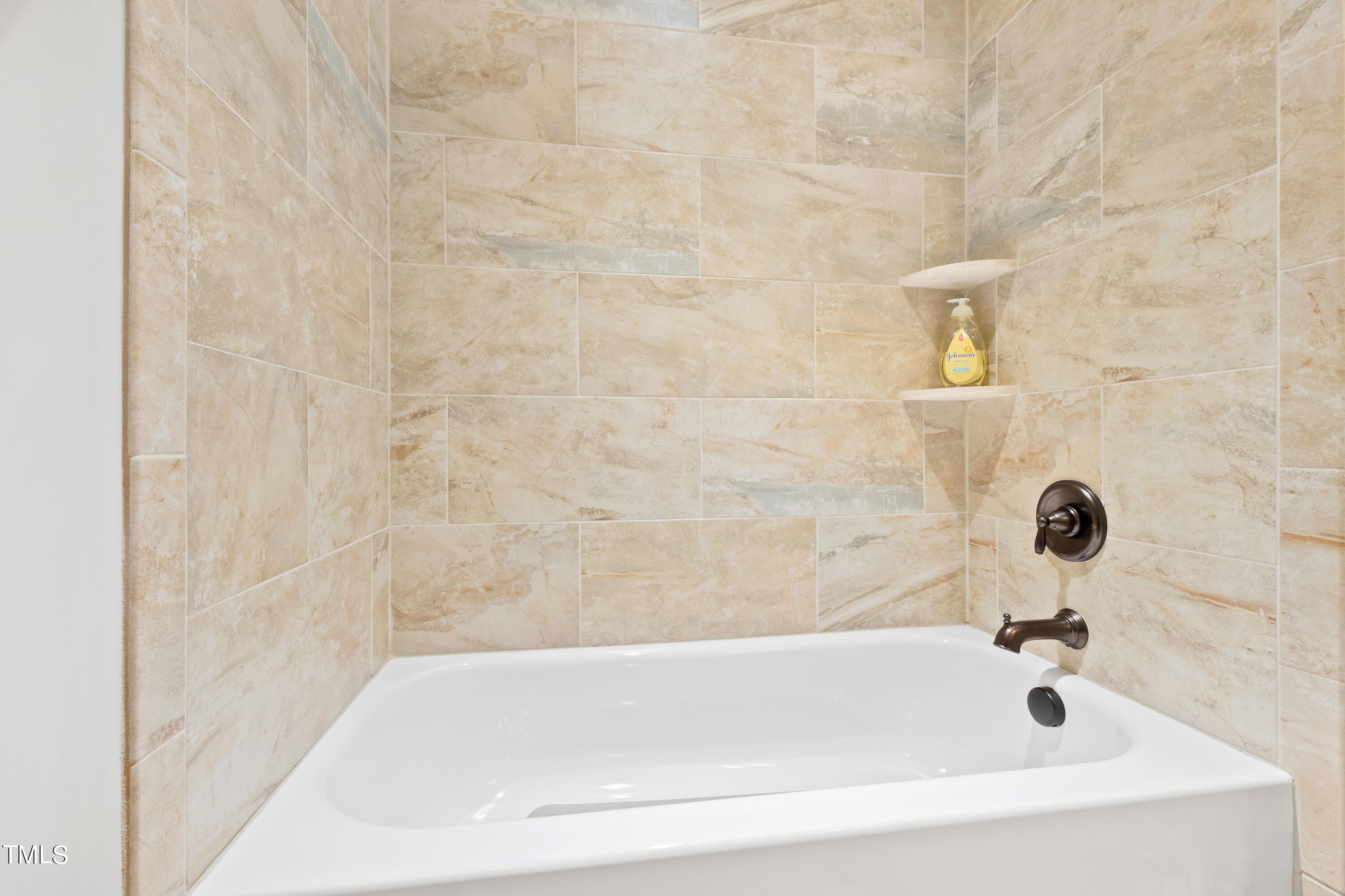 6213 Blanche Drive Raleigh, NC 27607 - Photo 38 of 48 a bathroom with a bathtub