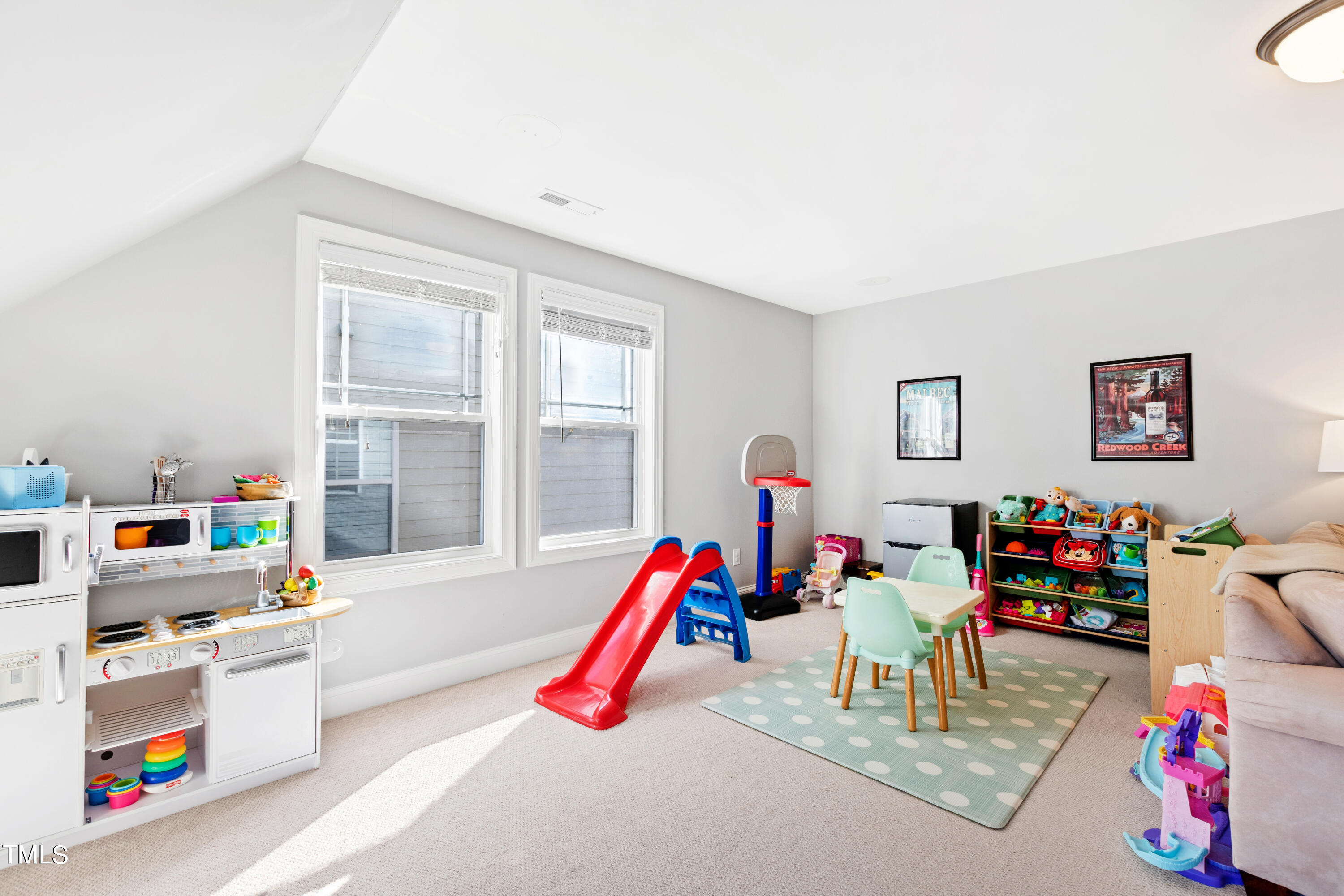 6213 Blanche Drive Raleigh, NC 27607 - Photo 39 of 48 a living room with furniture and a flat screen tv