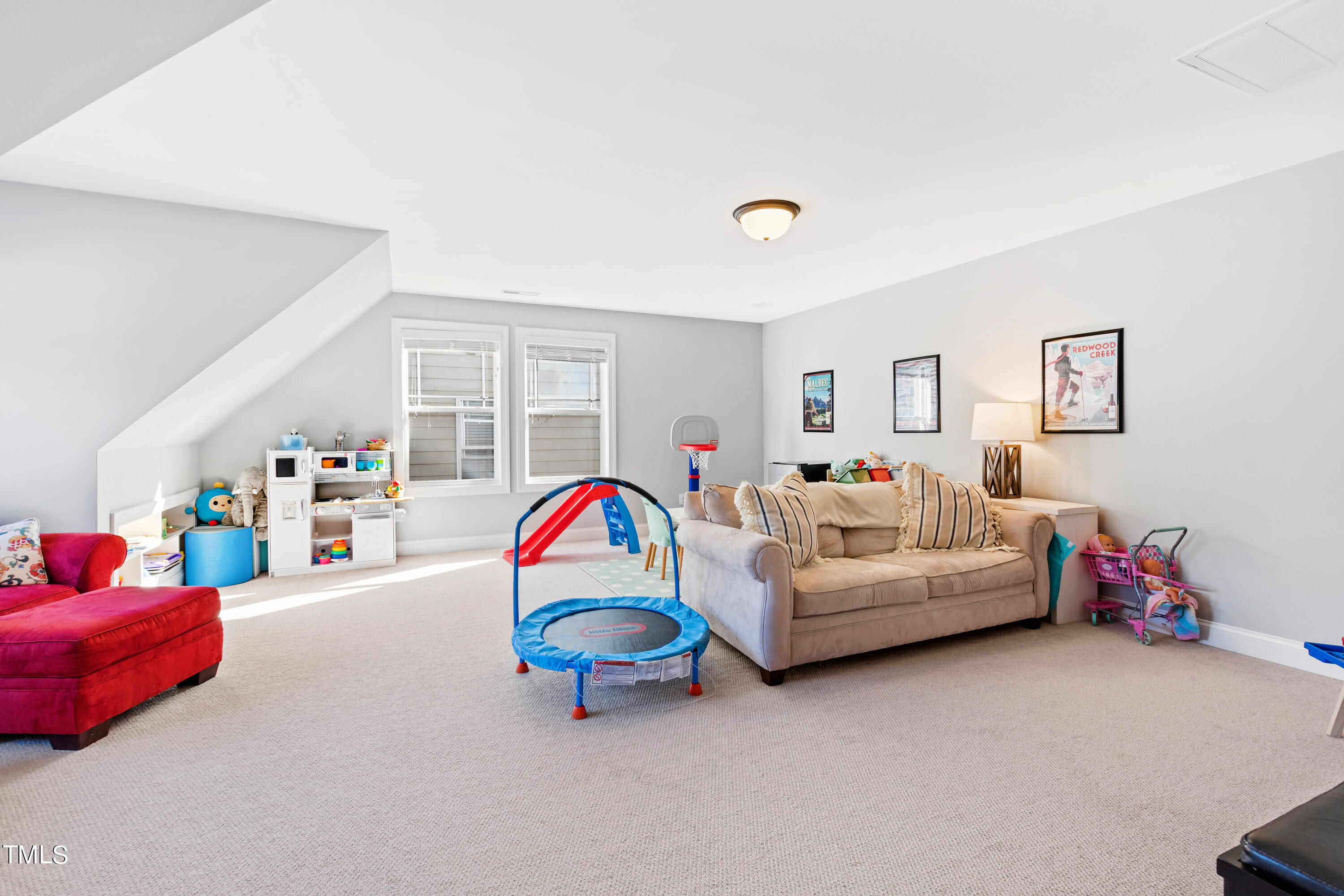 6213 Blanche Drive Raleigh, NC 27607 - Photo 42 of 48 a living room with furniture and a flat screen tv